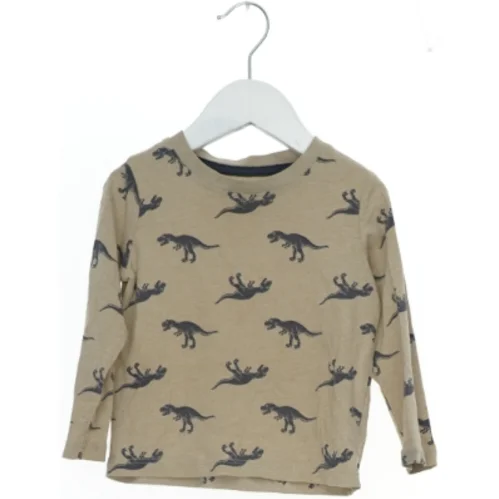 Langærmet bluse med dinosaur print fra H&M (str. 92)
