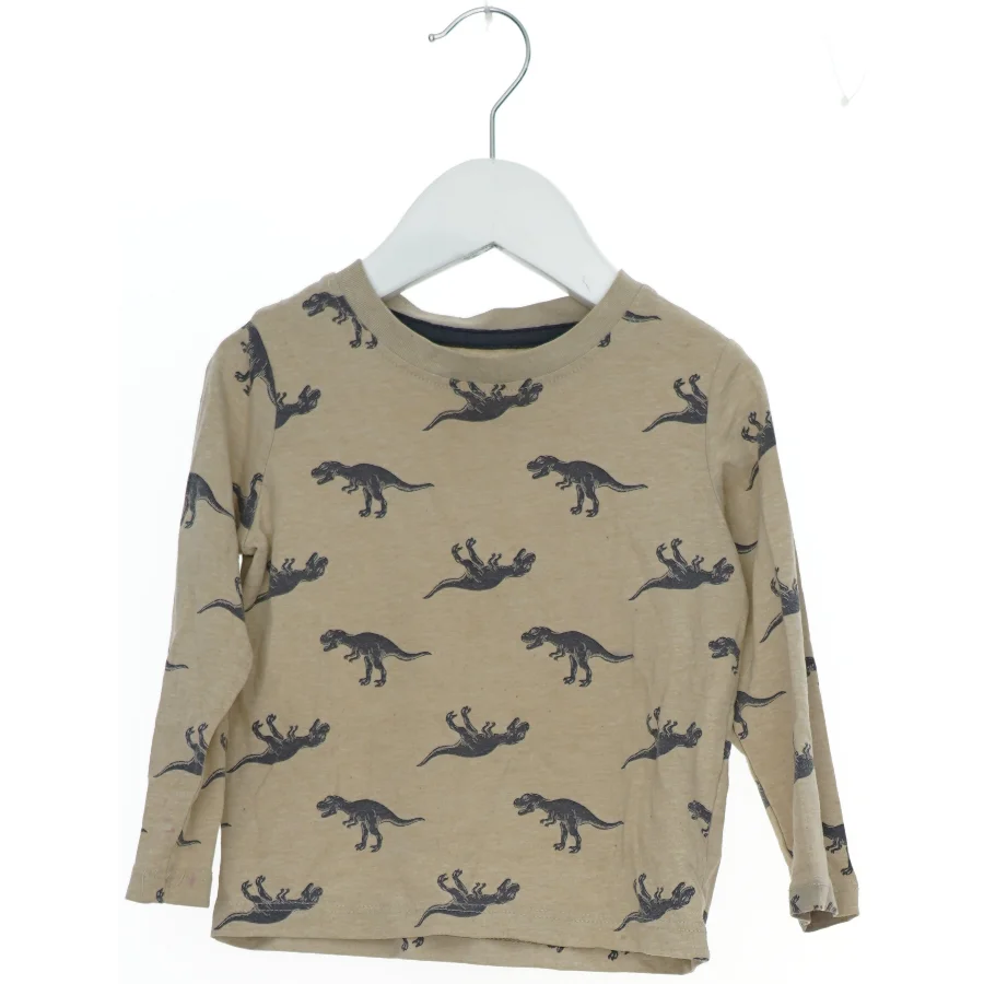 Langærmet bluse med dinosaur print fra H&M (str. 92)