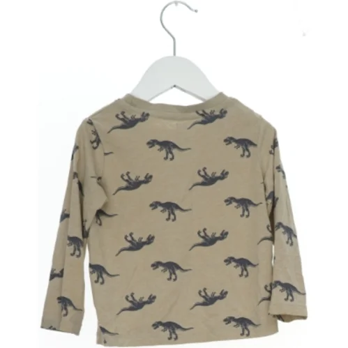 Langærmet bluse med dinosaur print fra H&M (str. 92)