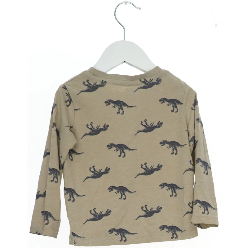 Langærmet bluse med dinosaur print fra H&M (str. 92)