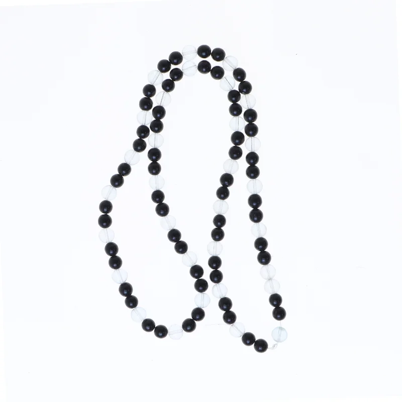 Halskæde med sorte og klare perler (str. 64 cm)