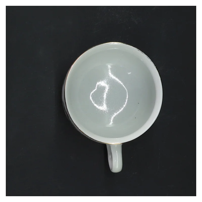 Porcelænskop med kristtorn motiv (str. Ø 7,5 cm)