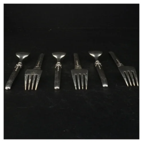 Sølvfarvede kagegafler