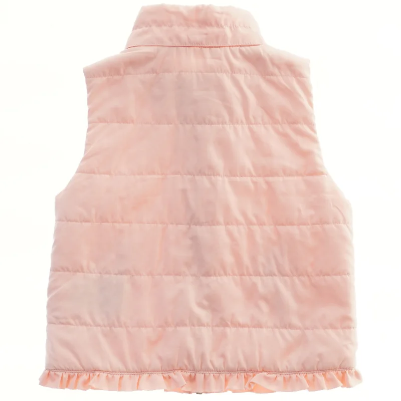 Lyserød vest med flæser fra H&M (str. 98)