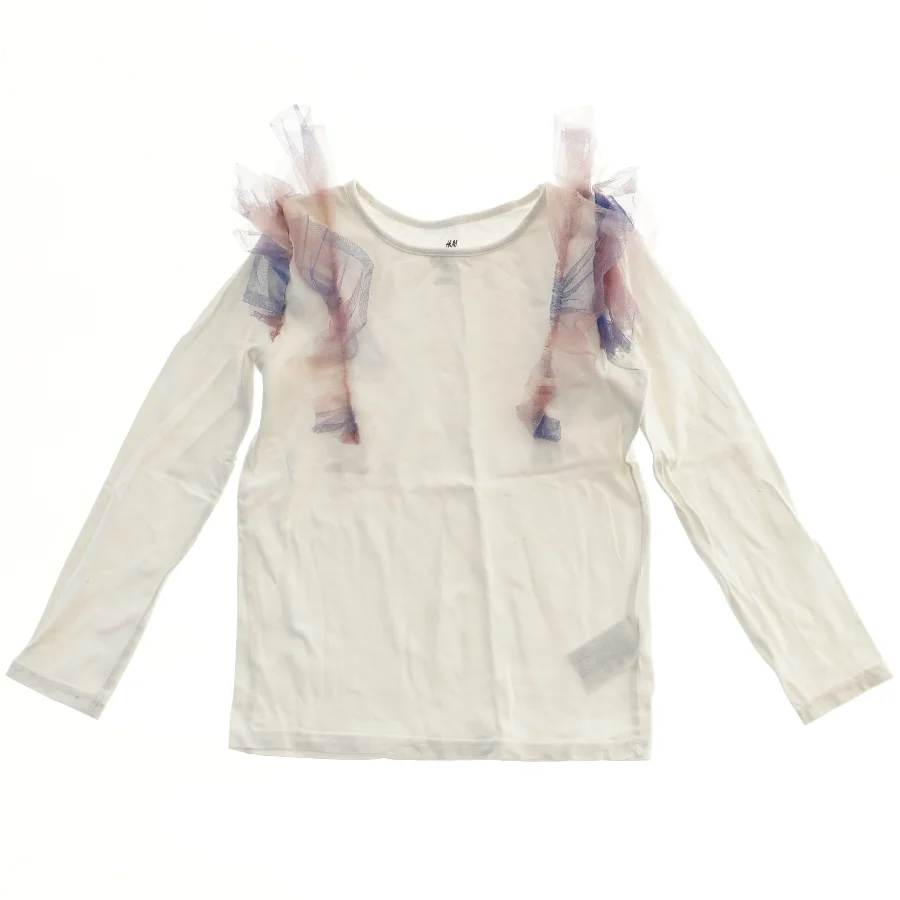 Langærmet bluse med tyl detaljer fra H&M (str. 122)