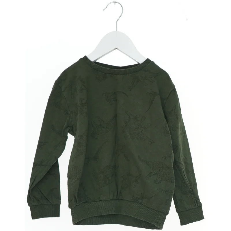 Grøn sweatshirt med dinosaurmønster fra Basic needs (str. 110)