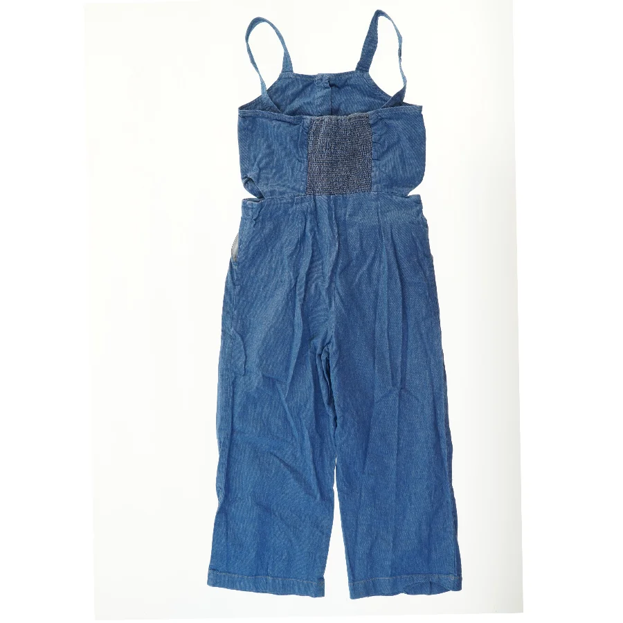 Blå ærmeløs buksedragt i denimlook fra Zara (str. 164)
