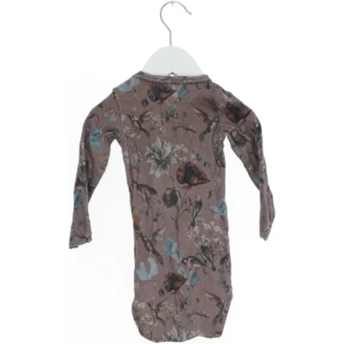 Langærmet bodystocking med blomstermotiv fra Name It (str. 74)