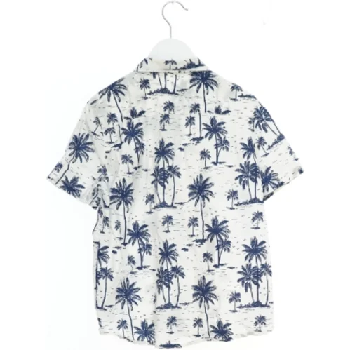 Kortærmet skjorte med palmemotiver fra H&M (str. 140)