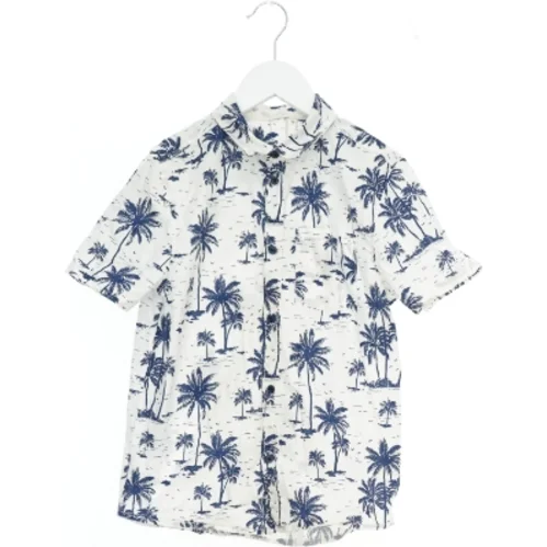 Kortærmet skjorte med palmemotiver fra H&M (str. 140)