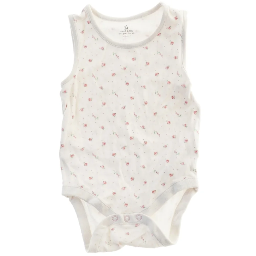 Baby bodystocking med blomstermønster fra Next (str. 86)