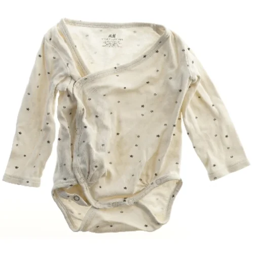 Hvid bodystocking med stjernemønster fra H&M (str. 68)