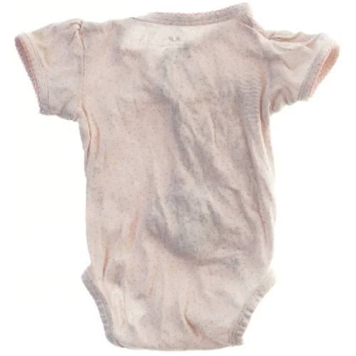 Lyserød bodystocking til baby fra H&M (str. 68)