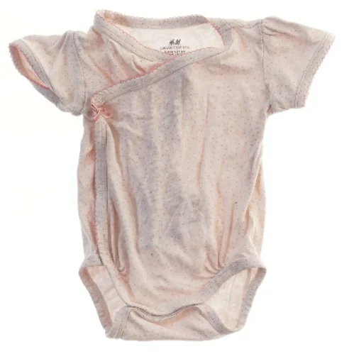 Lyserød bodystocking til baby fra H&M (str. 68)