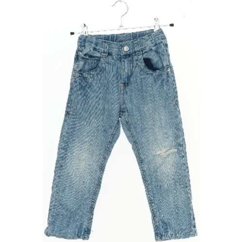 Bukser med slid detaljer (str. 104)