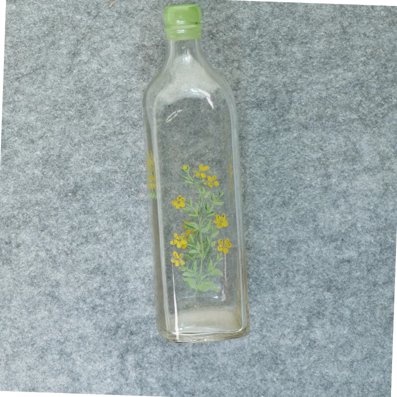 Gammel flaske vase med blomstermotiv (str. 27 x 7 cm)