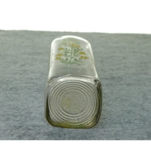 Gammel flaske vase med blomstermotiv (str. 27 x 7 cm)