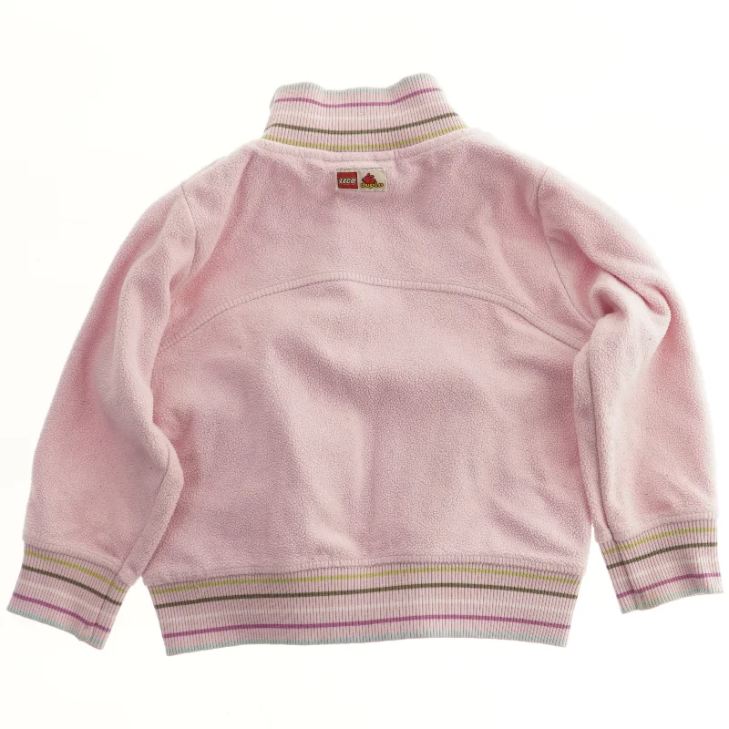 Lyserød trøje med lynlås fra Lego (str. 92)