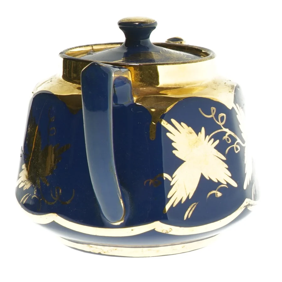 Blå tekande med gulddekorationer (str. 20 cm)