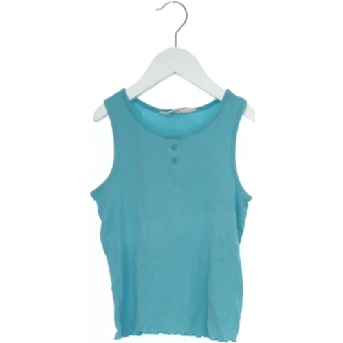 Tanktop i lyseblå fra H&M (str. 116)