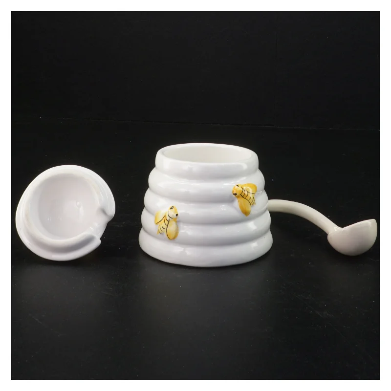 Honningkrukke med låg og ske (str. 10 komma 5 x 9 cm)