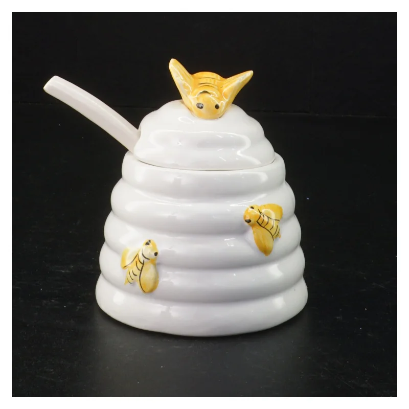 Honningkrukke med låg og ske (str. 10 komma 5 x 9 cm)