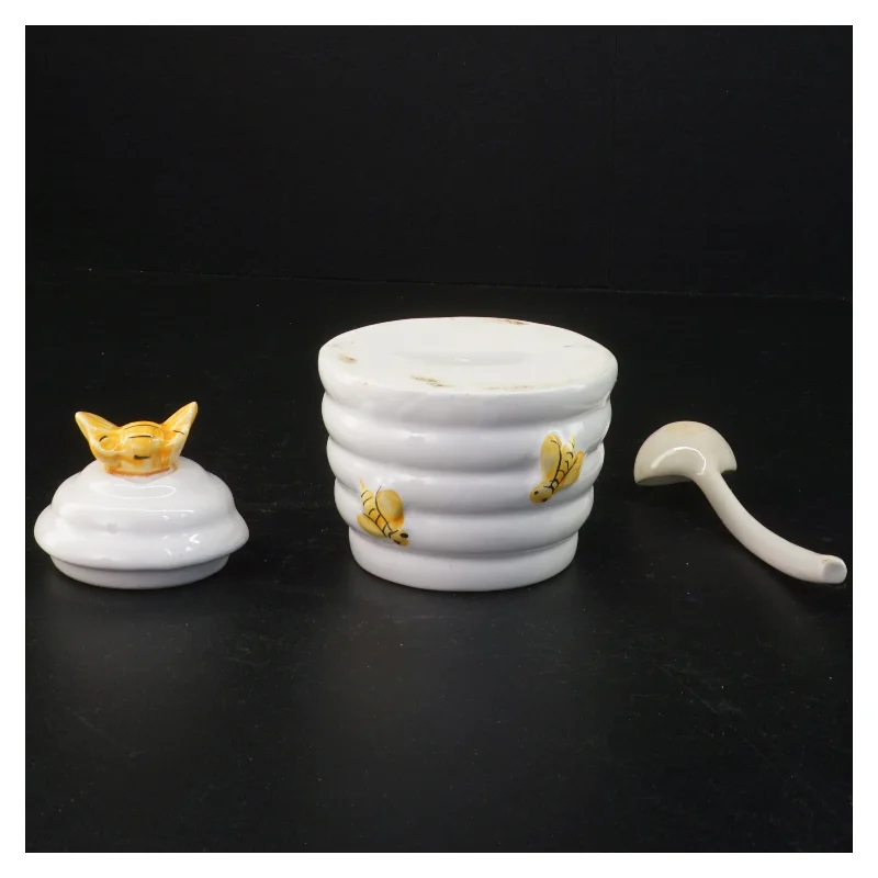 Honningkrukke med låg og ske (str. 10 komma 5 x 9 cm)