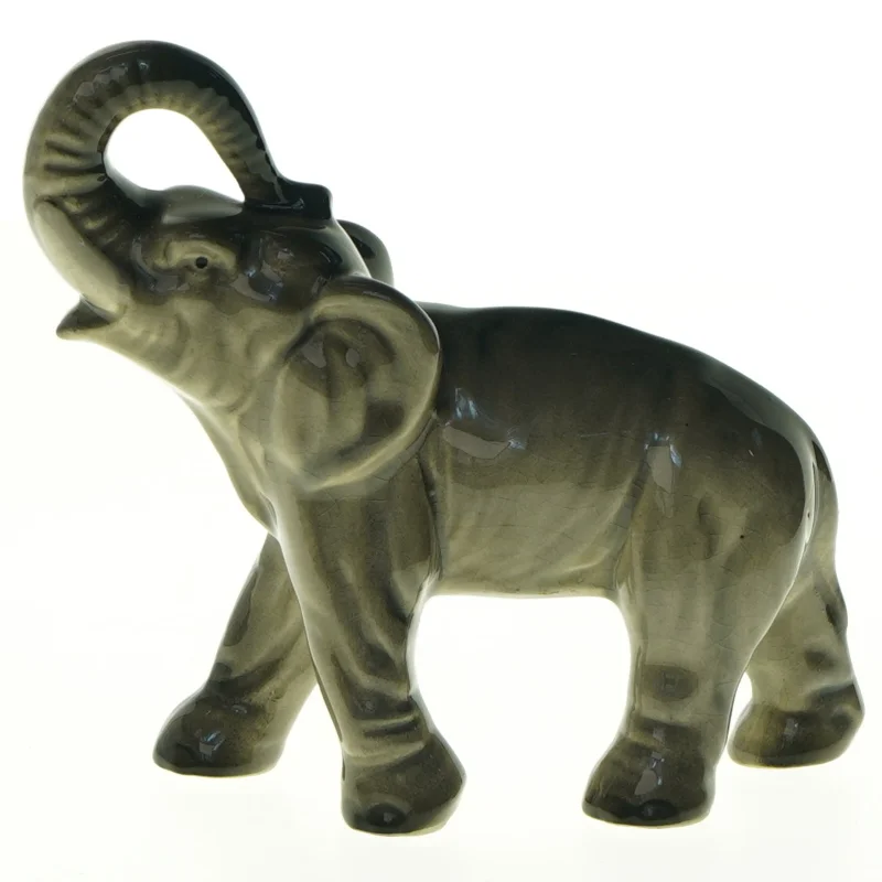 Elefant med løftet snabel i porcelæn (str. 17 x 15 cm)