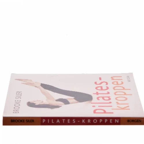 Pilates-kroppen : nøgle til personlig frigørelse : komplet vejledning i hvordan du selv kan gøre kroppen længere, stærkere og mere spændstig - uden maskiner af Brooke Siler (Bog)