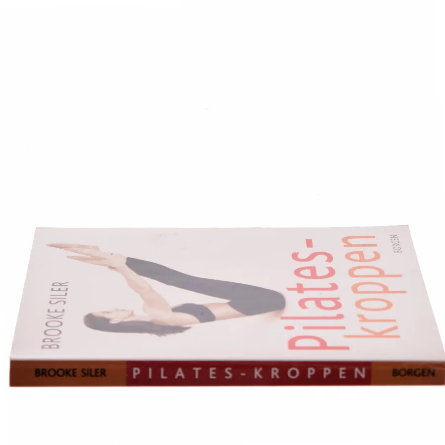 Pilates-kroppen : nøgle til personlig frigørelse : komplet vejledning i hvordan du selv kan gøre kroppen længere, stærkere og mere spændstig - uden maskiner af Brooke Siler (Bog)