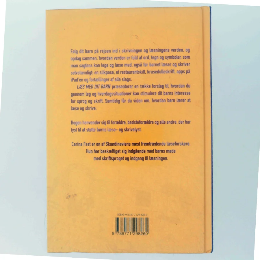 Læs med dit barn : sådan støtter du dit barns skrive- og læseudvikling af Carina Fast (Bog)