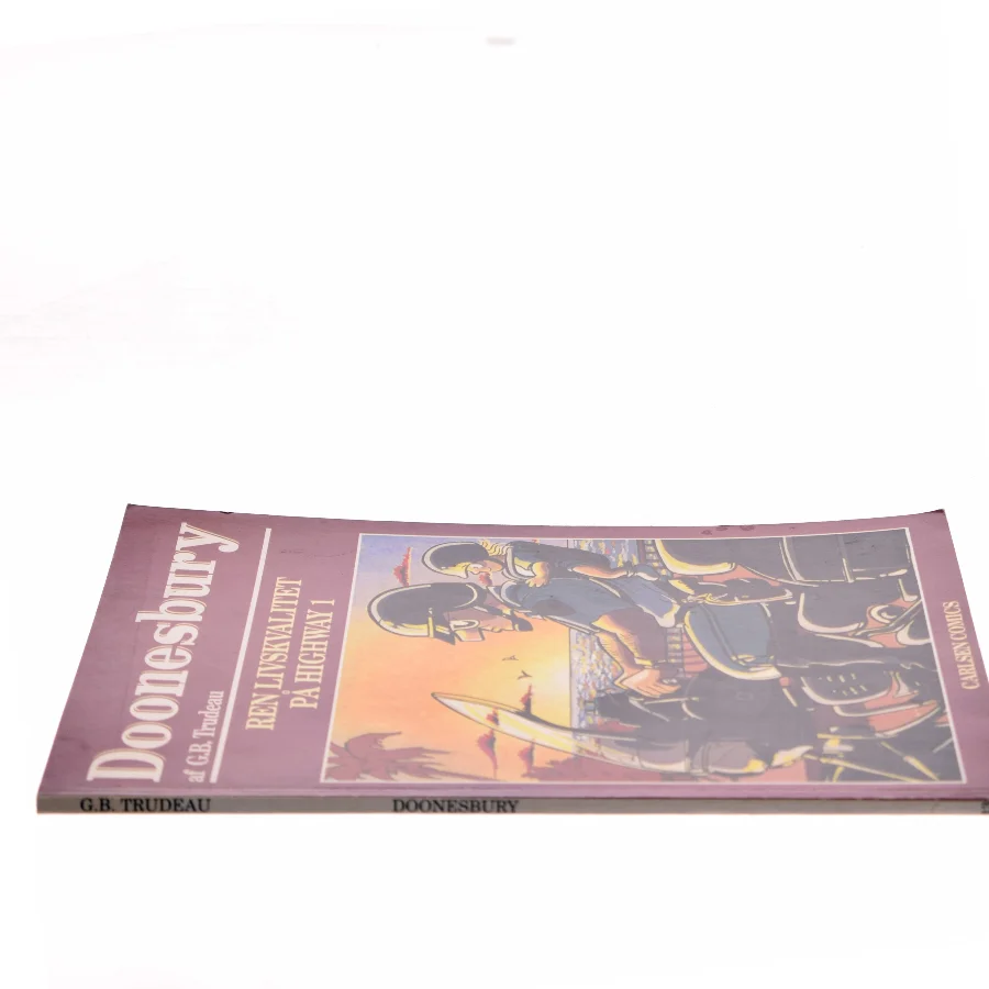 Doonesbury. 12, Jeg dækker dig, mens du hydrerer / overs. af Per Vadmand ; tekstet af Rebecca Løwe. - 1993 af G. B. Trudeau (Bog)