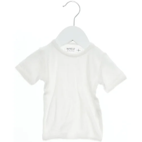 Kortærmet bodystocking fra Wheat (str. 62)