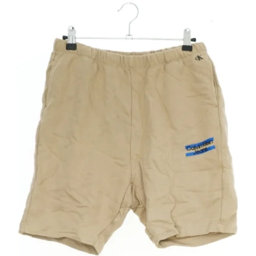 Beige shorts fra Calvin Klein (str. 164)
