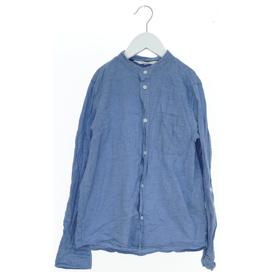 Lys blå skjorte med lange ærmer fra H&M (str. 140)