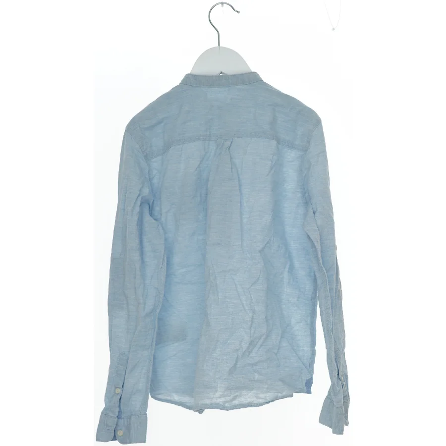 Lyseblå skjorte til børn fra H&M (str. 146)