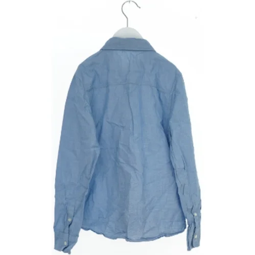 Blå skjorte med lange ærmer fra H&M (str. 134)