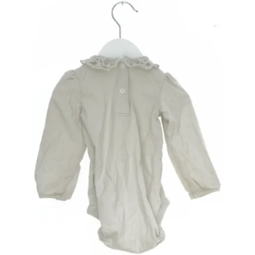 Langærmet bodystocking med blondekrave fra H&M (str. 74)