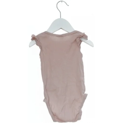 Lyserød bodystocking fra H&M (str. 74)