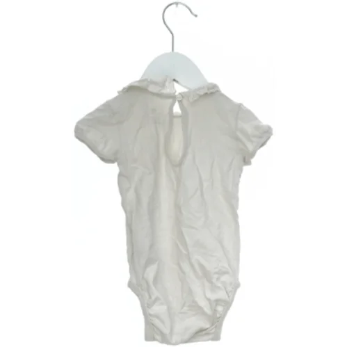 Hvid bodystocking med krave fra H&M (str. 74)