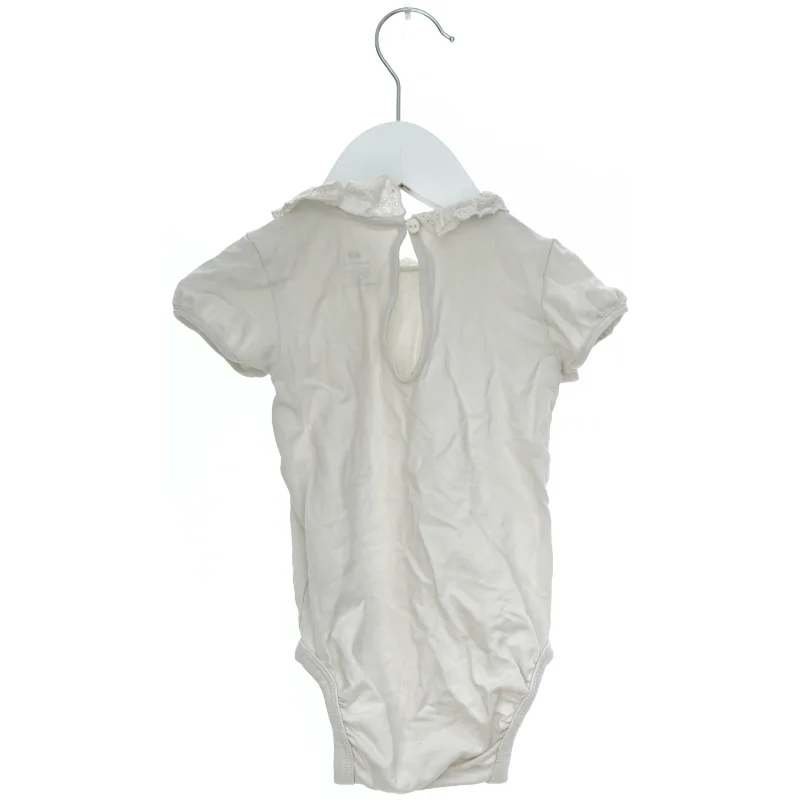 Hvid bodystocking med krave fra H&M (str. 74)