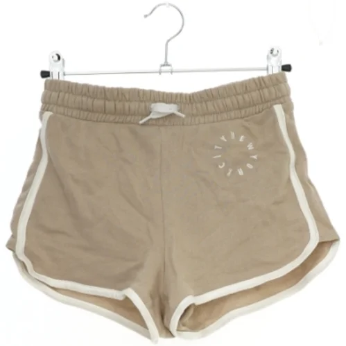 Beige shorts med hvid kant fra H&M (str. 146)