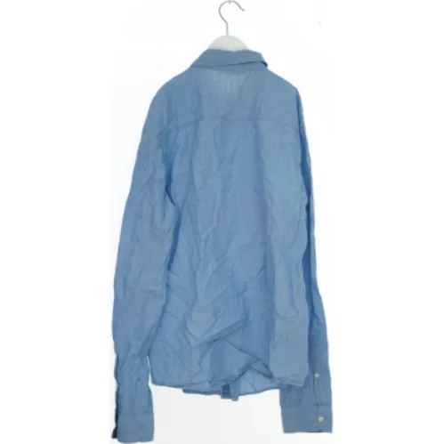 Lyseblå skjorte fra H&M (str. 170)