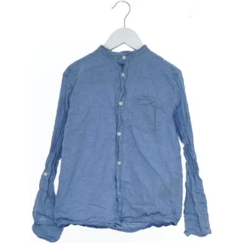 Langærmet blå skjorte fra H&M (str. 140)