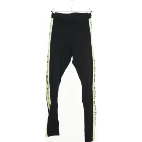 Lange sorte leggings med gule striber fra H&M (str. 164)