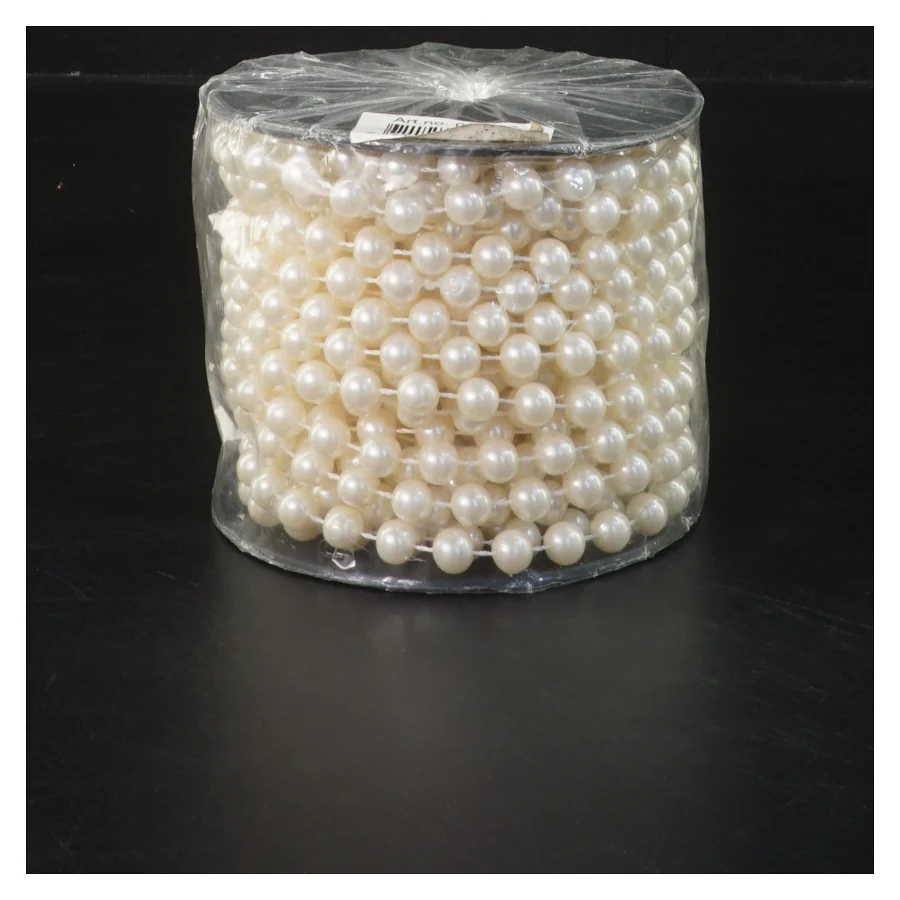 Rulle med dekorativt perlebånd