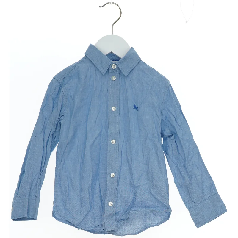 Lyseblå langærmet skjorte fra H&M (str. 104)