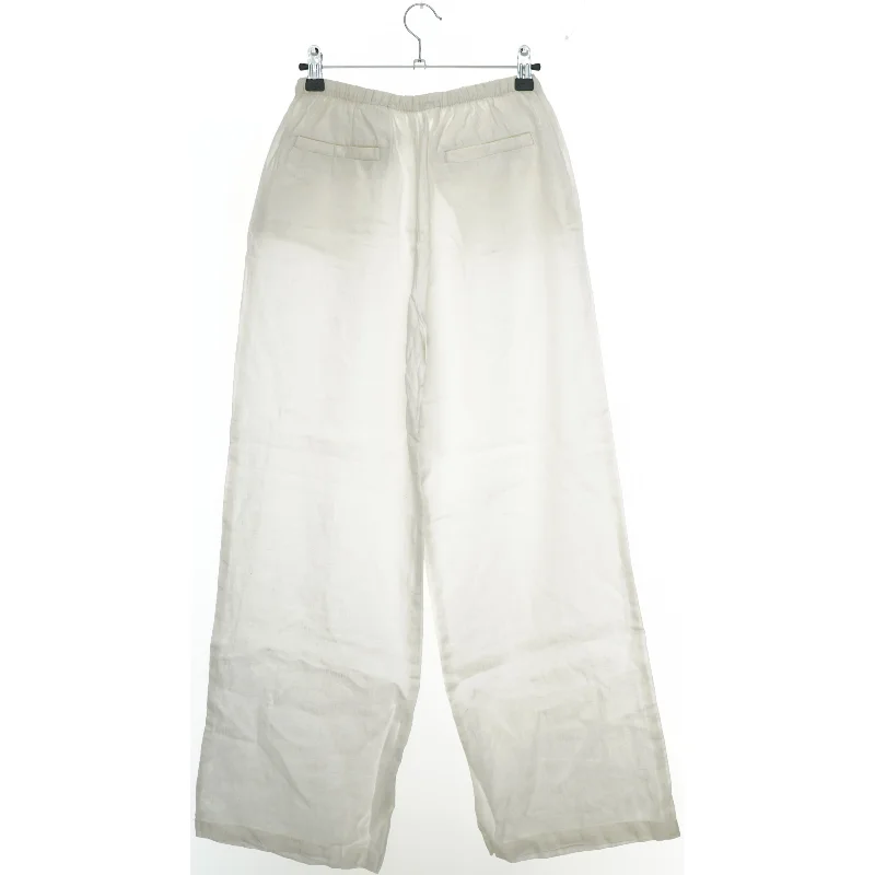 Hvide bukser i hør fra H&M (str. 158)