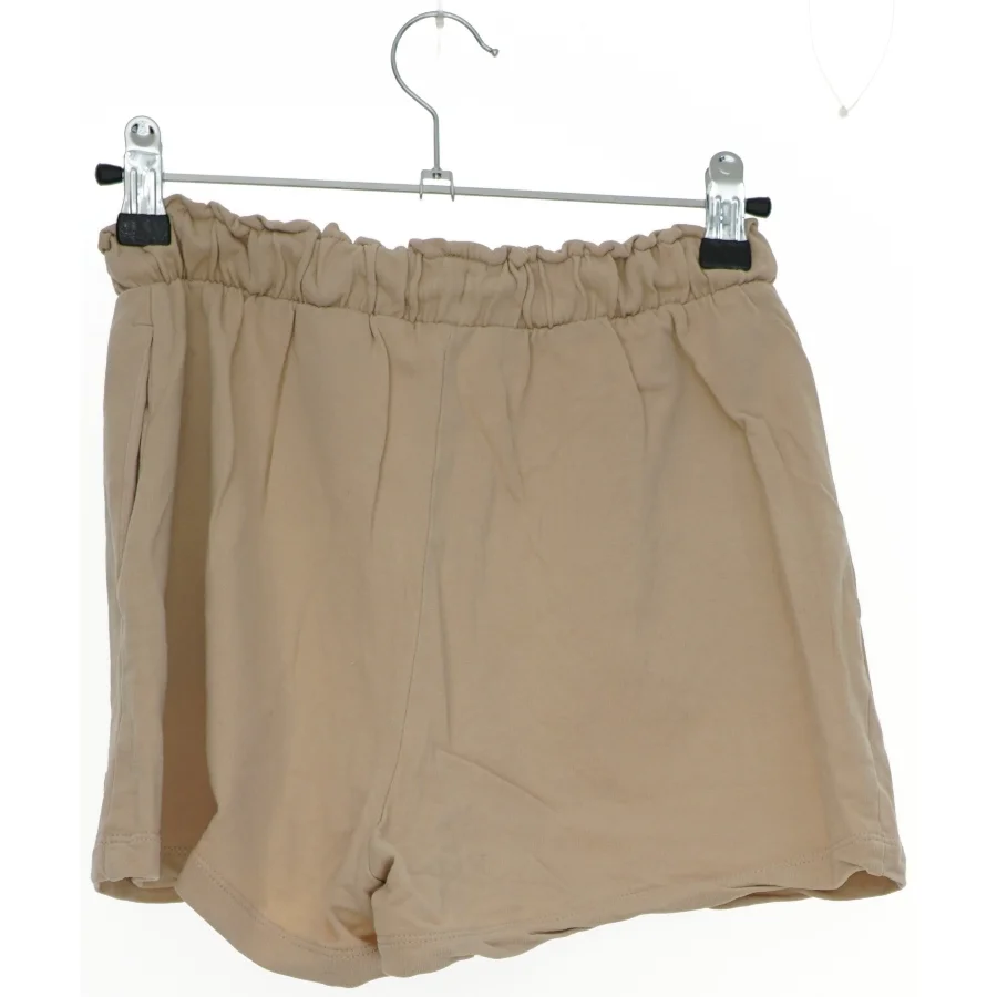 Beige shorts med elastisk talje fra H&M (str. 164)