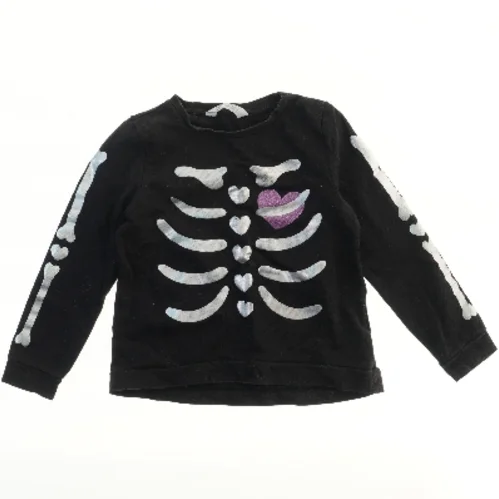 Bluse med skelet design fra H&M (str. 122)